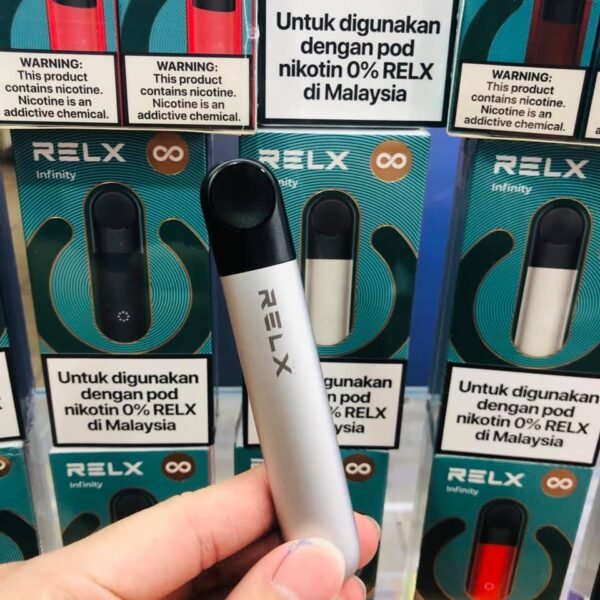 RELX INFINITY DEVICE - VAPE SINGAPORE STORE Relx Infinity Device Vape Ready stock in our sg singapore store online shop for same day delivery. The Newest addition to the RELX line up! With its innovative leak-resistant maze coil and SmartPace Vibration technology, introducing the RELX Infinity Vape Pod Device Kit! The RELX Infinity is jam packed with various features from its dual charging system and sleek ergonomic design. The Infinity optimizes the activation draw to be set at the perfect temperature providing you with rich vapor production and excellent flavor. The device features haptic vibration feedback when you insert the pre-filled pod. RELX Infinity pods are leak resistant due to its new maze coil design. The coil features 11 structural layers that prevent internal leaks and condensation for a more secure vaping experience. Supports the new RELX Infinity Portable Charging Cases offering up to 2 and a half extra days of charge with it’s 1000maH of battery life. Charging case sold separately. The battery features 380mAH for long lasting everyday usage and a massive 1.9mL capacity for its pre-filled nicotine salt e-juice pods that lasts approximately 650 puffs. pods come in a wide range of flavors to choose from. Specification : Built-in Battery 380mAh Fast Charging with Type-C Cable SuperSmooth Technology Automatic (Draw activated) Magnetic Pod Connection Portable Charge Case – Sold Separately E-Liquid Capacity: 2ml Compatible Pod With : Relx Infinity Pod Available Color : Gold Red Black Deep Blue SG VAPE COD SAME DAY DELIVERY , CASH ON DELIVERY ONLY. TAKE BULK ORDER /MORE ORDER PLS CONTACT ME :  WhatsApp Us VIEW OUR DAILY NEWS INFORMATION : Telegram Channel